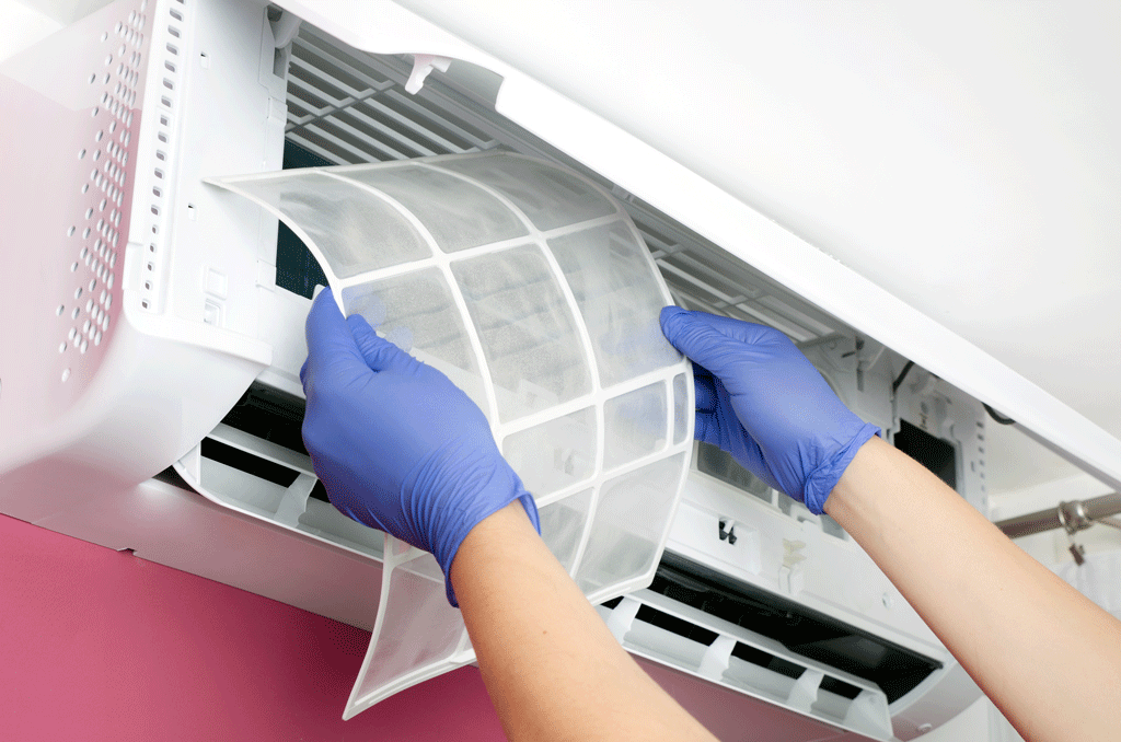 person with gloves on changing out air filter indoor air quality kingman az bullhead city az 