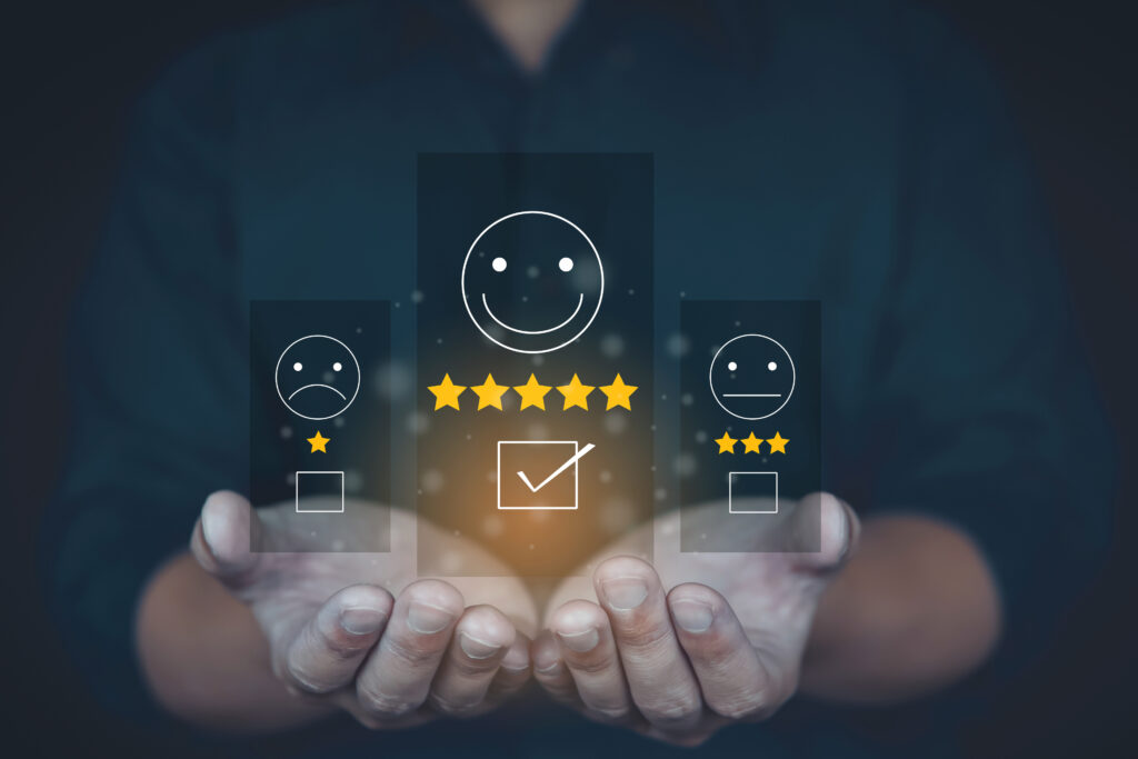A hand holding a smiley face and five stars on a visual screen, representing positive customer feedback testimonial and testimony for Heating And AC Repair Company