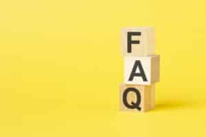 FAQ - text on wooden cubes, on yellow background, HVAC System Optimization.