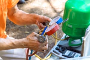 Air conditioning technician servicing, HVAC Calibration.